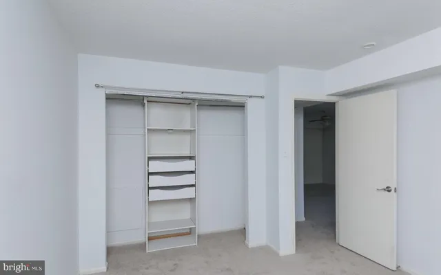 a view of an empty walk in closet