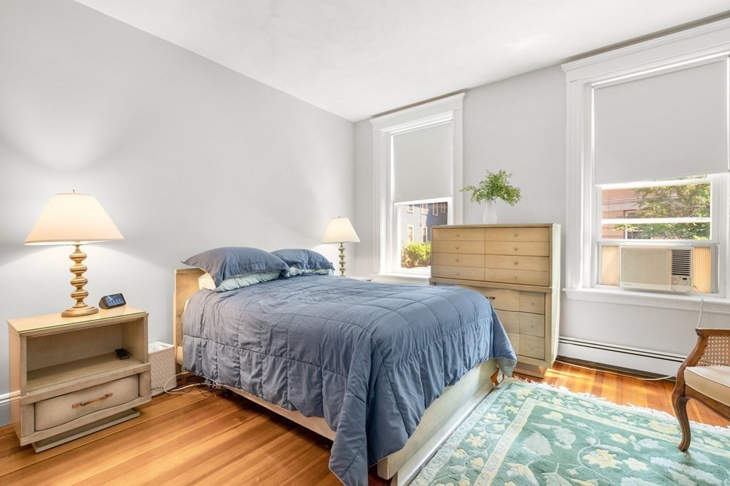 815 Centre Street, Unit 1 Boston, MA 02130 - Photo 11 of 30 a bedroom with a bed and a window