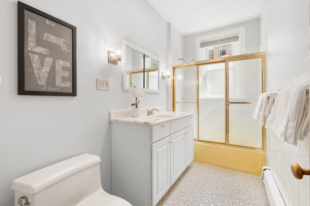 815 Centre Street, Unit 1 Boston, MA 02130 - Photo 20 of 30 a bathroom with a sink toilet and shower