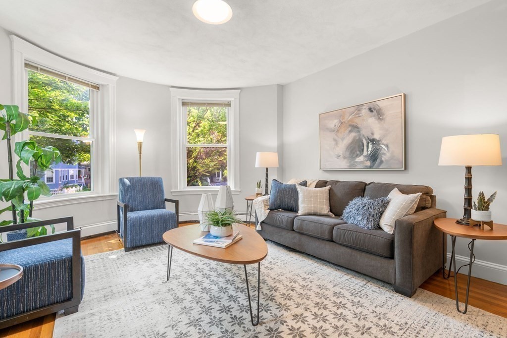 815 Centre Street, Unit 1 Boston, MA 02130 - Photo 2 of 30 a living room with furniture and a large window