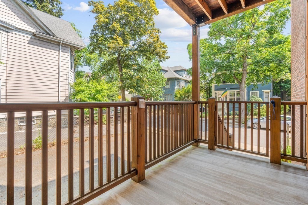 815 Centre Street, Unit 1 Boston, MA 02130 - Photo 24 of 30 a view of a wooden fence