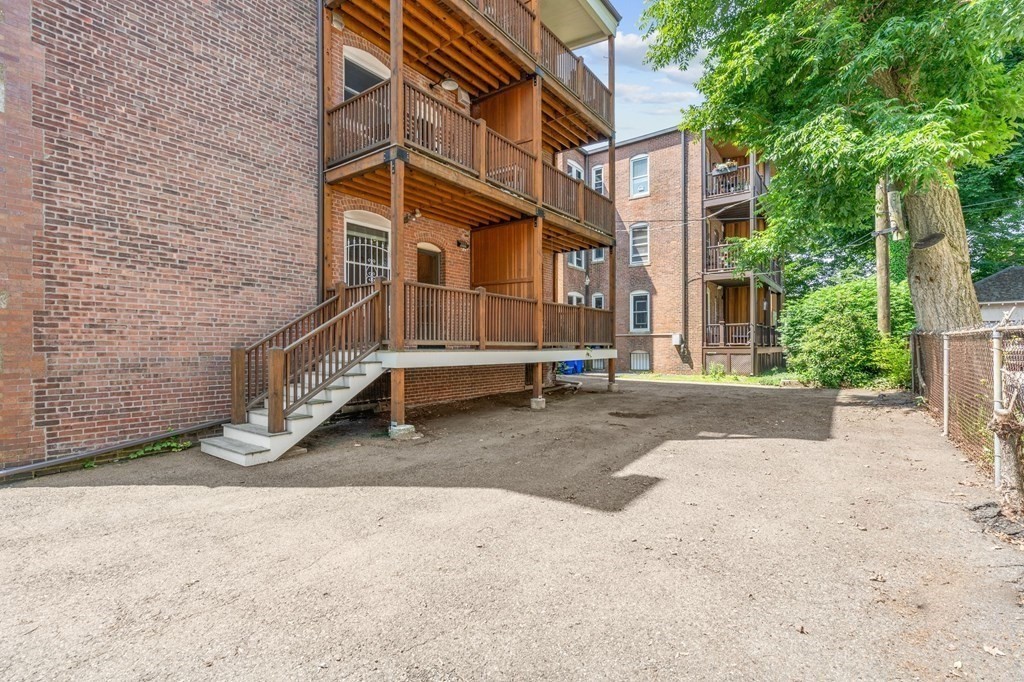 815 Centre Street, Unit 1 Boston, MA 02130 - Photo 26 of 30 a view of a car park in front of house