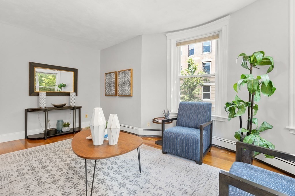 815 Centre Street, Unit 1 Boston, MA 02130 - Photo 4 of 30 a living room with furniture potted plant and wooden floor