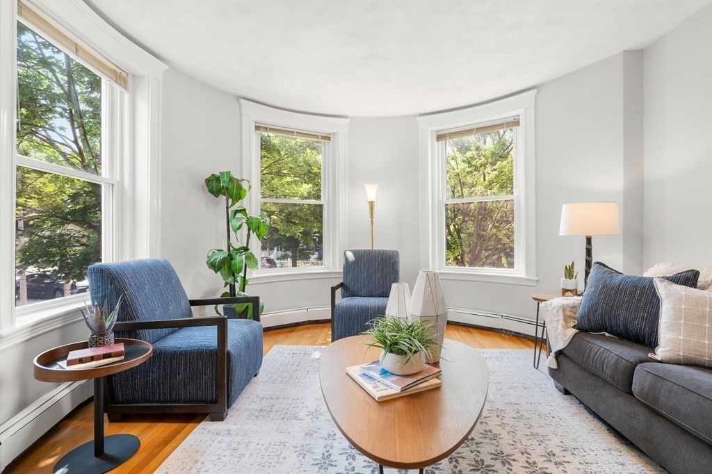 815 Centre Street, Unit 1 Boston, MA 02130 - Photo 5 of 30 a living room with furniture and a large window