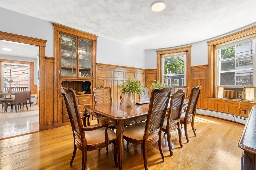 815 Centre Street, Unit 1 Boston, MA 02130 - Photo 6 of 30 a view of a dining room with furniture and wooden floor