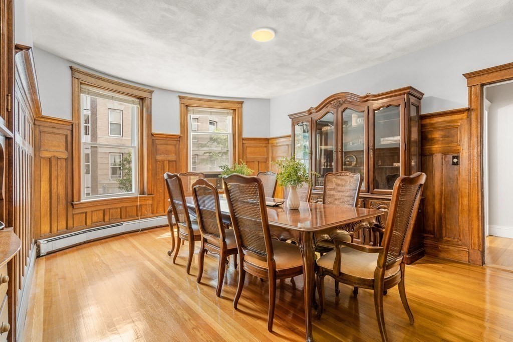 815 Centre Street, Unit 1 Boston, MA 02130 - Photo 8 of 30 a view of a dining room with furniture window and wooden floor