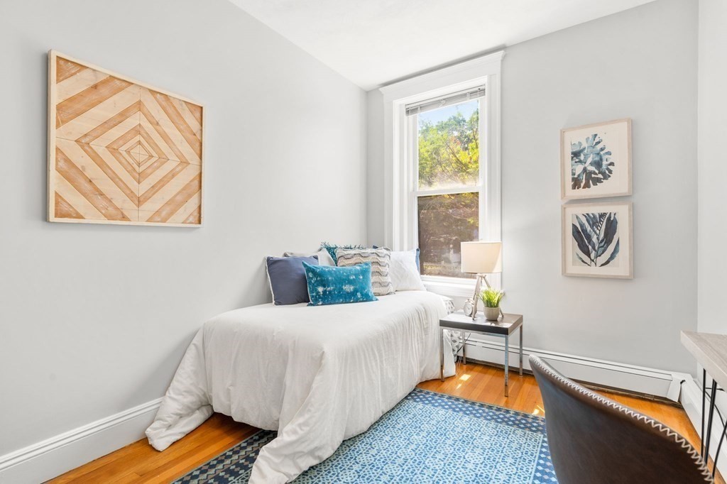 815 Centre Street, Unit 1 Boston, MA 02130 - Photo 10 of 30 a bedroom with a bed and a window