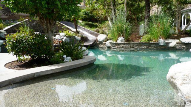 567 Oak Tree Court Simi Valley, CA 93065 - Photo 12 of 17 a view of a lake with a wooden fence