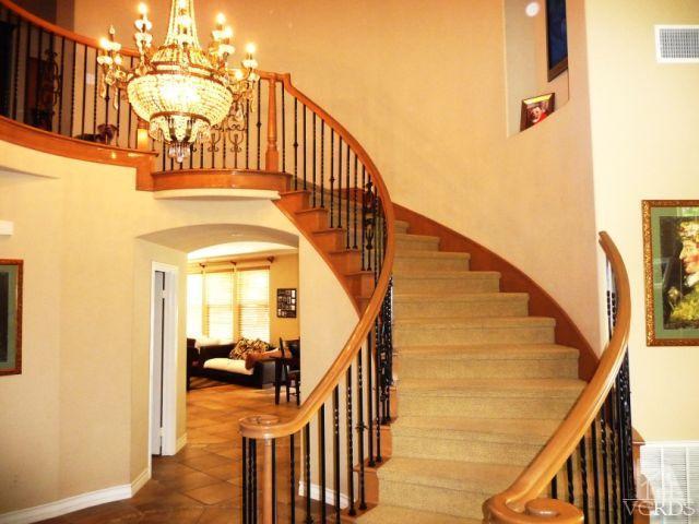 567 Oak Tree Court Simi Valley, CA 93065 - Photo 3 of 17 a view of a hallway with wooden floor and stairs