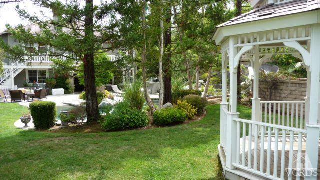567 Oak Tree Court Simi Valley, CA 93065 - Photo 9 of 17 a view of a chair and table in the garden