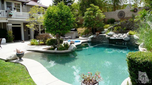 567 Oak Tree Court Simi Valley, CA 93065 - Photo 10 of 17 a view of a lake with couches chairs and potted plants