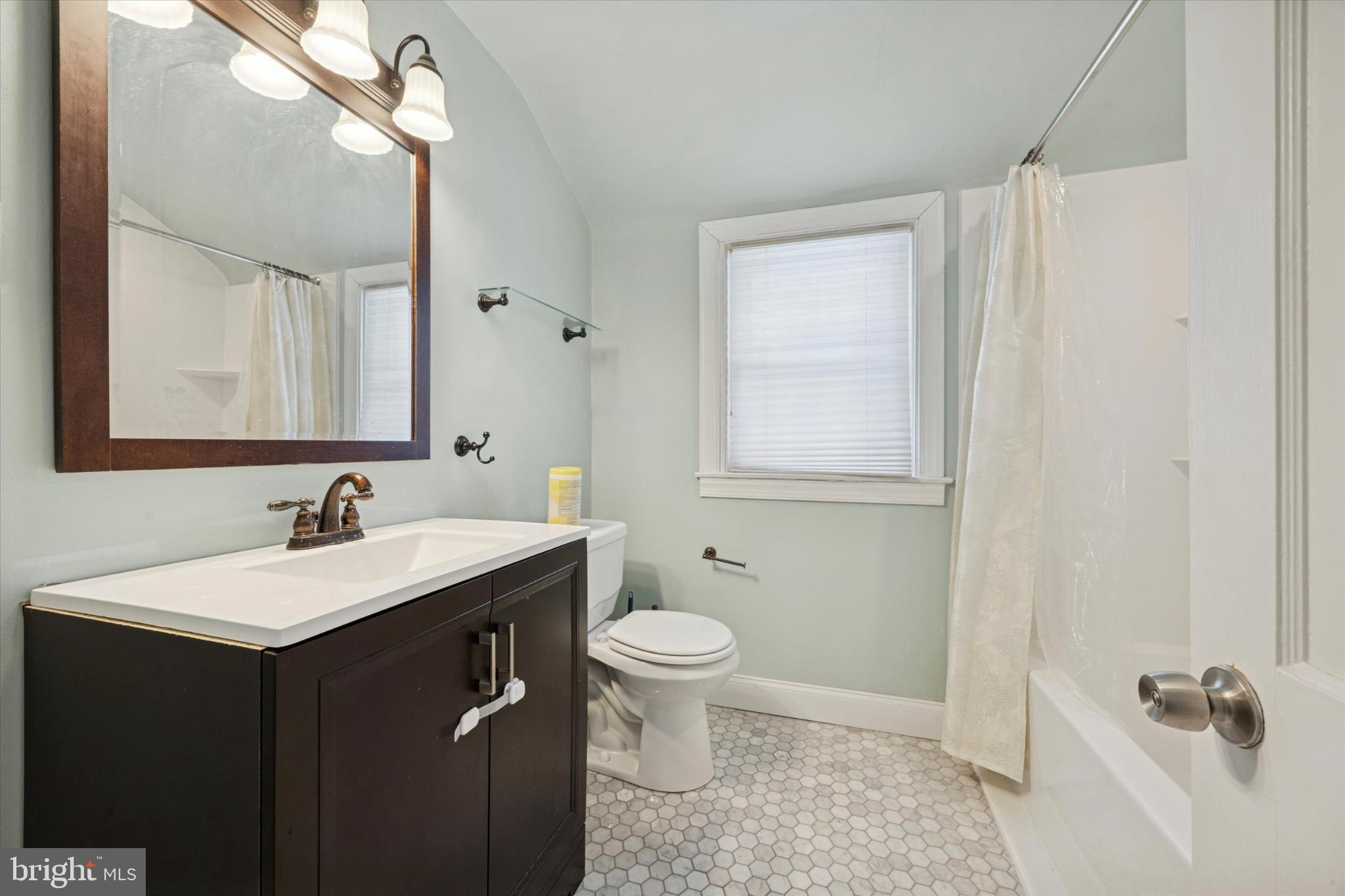 606 West Springfield Road Springfield, PA 19064 - Photo 13 of 25 a bathroom with a sink and a toilet