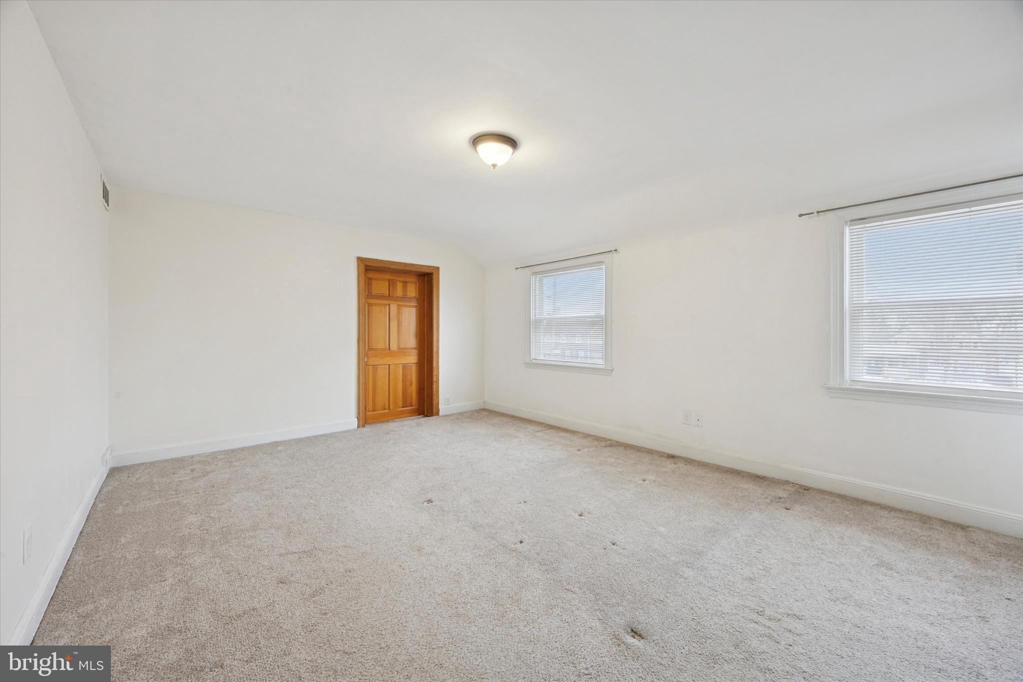 606 West Springfield Road Springfield, PA 19064 - Photo 15 of 25 a view of an empty room with a window