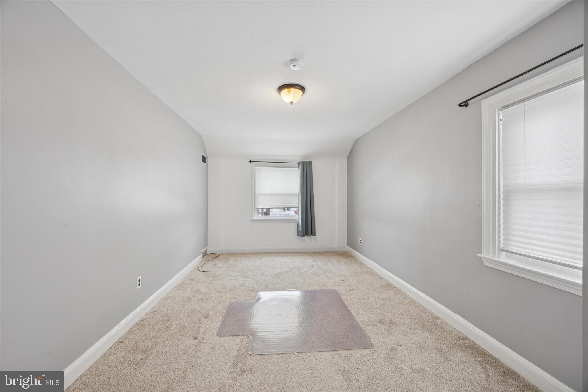 606 West Springfield Road Springfield, PA 19064 - Photo 21 of 25 a view of an empty room with a window