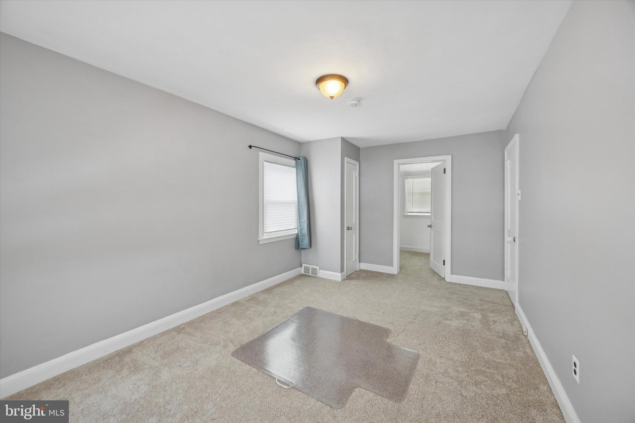 606 West Springfield Road Springfield, PA 19064 - Photo 22 of 25 an empty room with windows