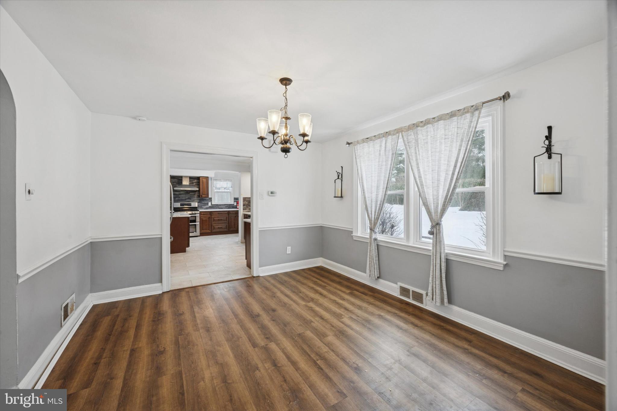 606 West Springfield Road Springfield, PA 19064 - Photo 4 of 25 a view of empty room with wooden floor