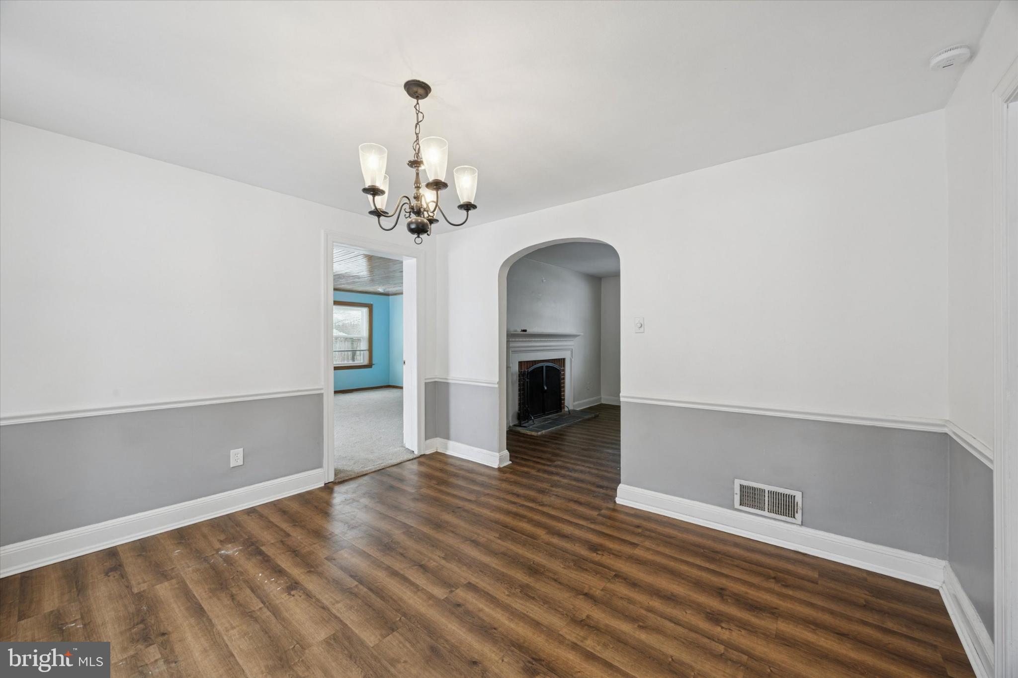 606 West Springfield Road Springfield, PA 19064 - Photo 5 of 25 wooden floor in an empty room with a window