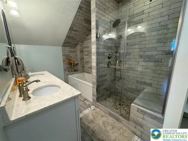 a bathroom with a sink and mirror