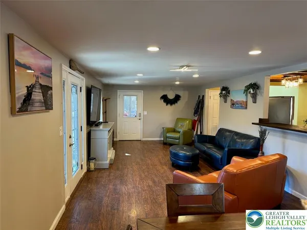 a room with furniture and wooden floor