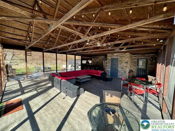 a backyard of a house with outdoor seating
