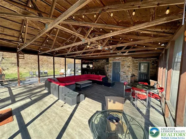 a view of a car park with furniture