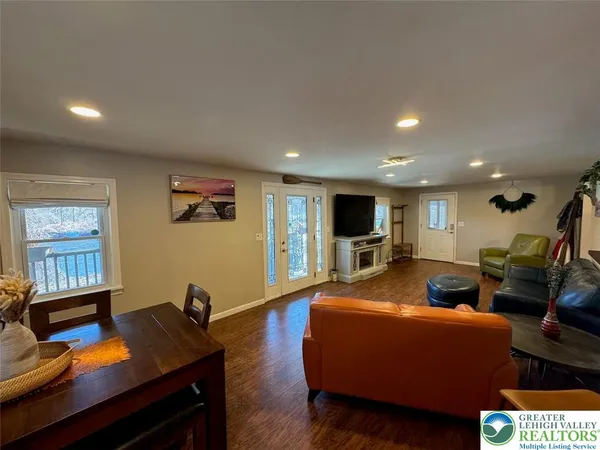 a bedroom with furniture and a window