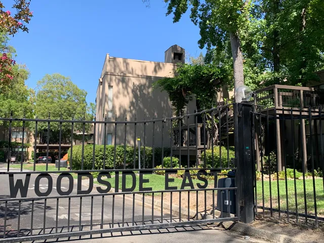 a view of street along with deck and garden