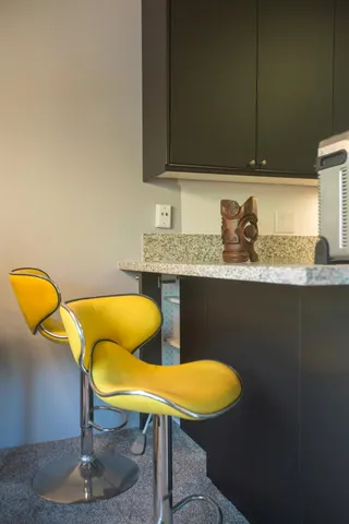 a bathroom with a granite countertop sink a mirror and vanity