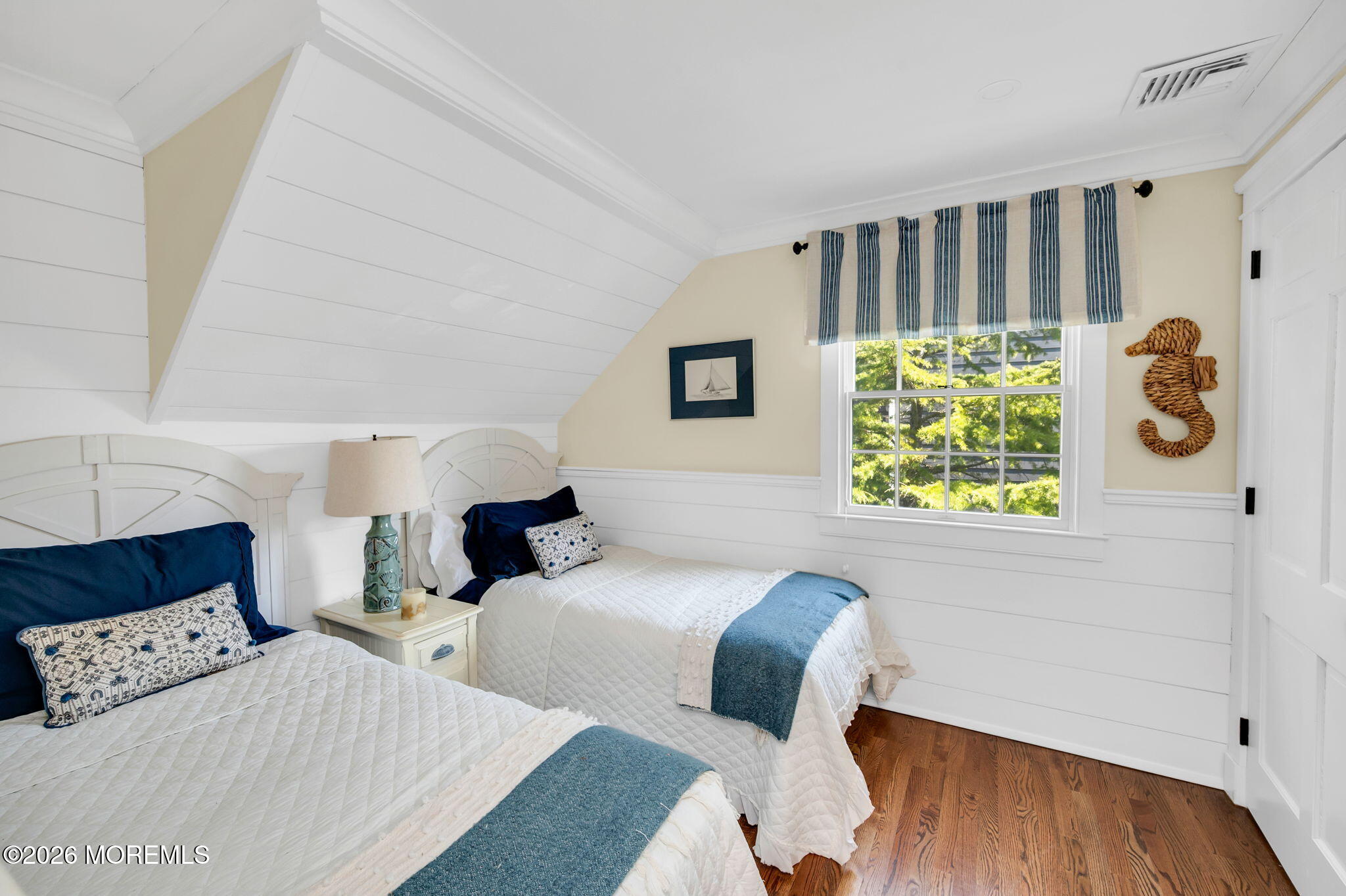 149 Squan Beach Drive Mantoloking, NJ 08738 - Photo 36 of 47 a bedroom with two beds and painting on the wall
