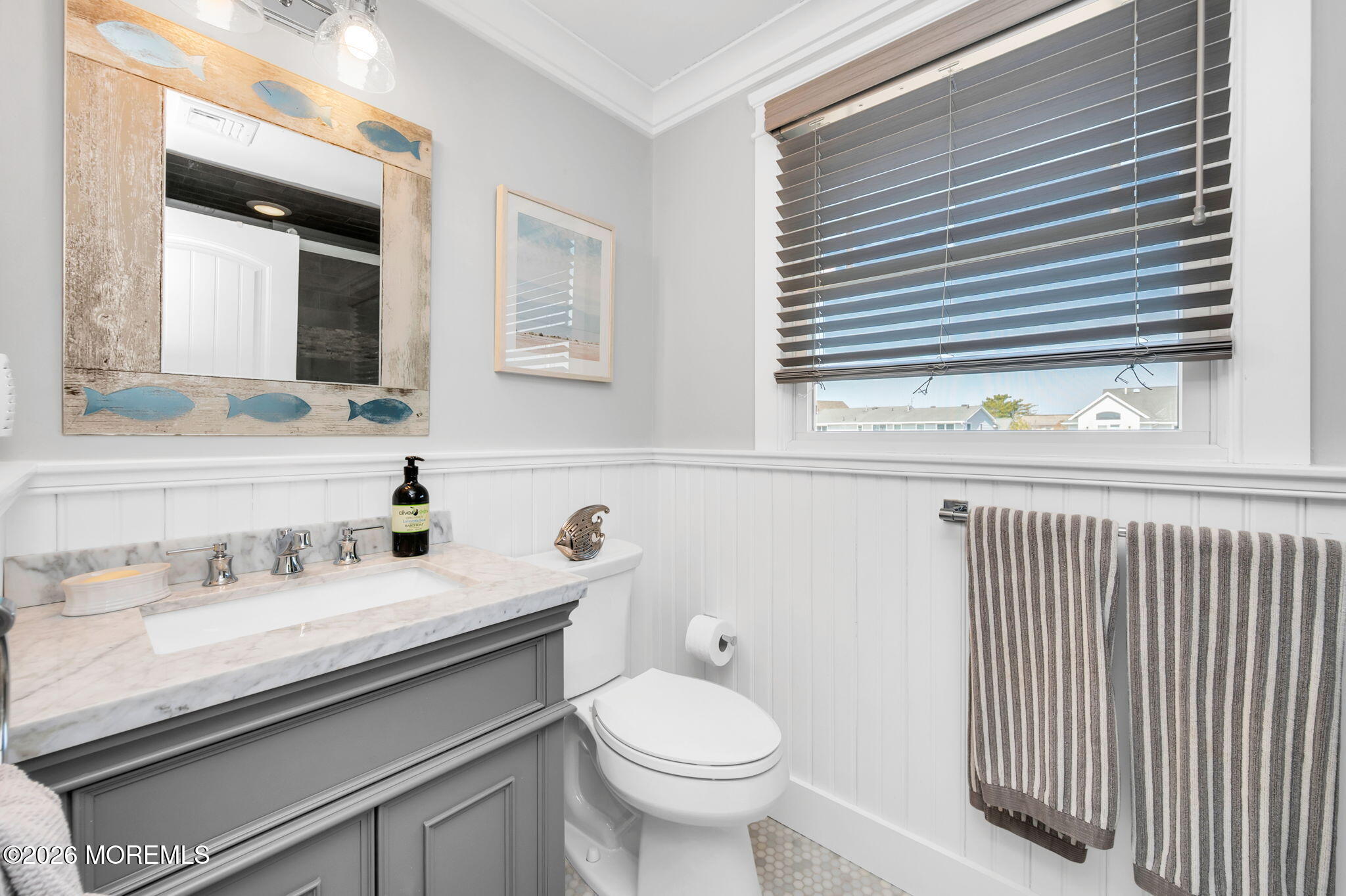 149 Squan Beach Drive Mantoloking, NJ 08738 - Photo 37 of 47 a bathroom with a sink and a toilet