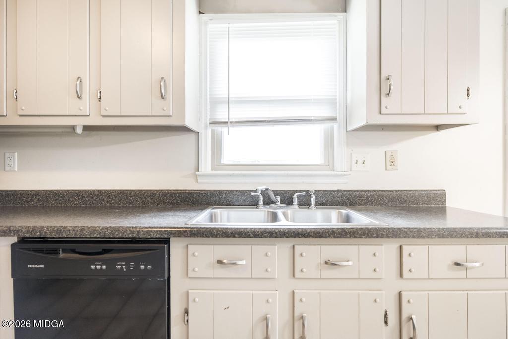 112 Prairie Boulevard Centerville, GA 31028 - Photo 12 of 32 a kitchen with granite countertop white cabinets and a stove
