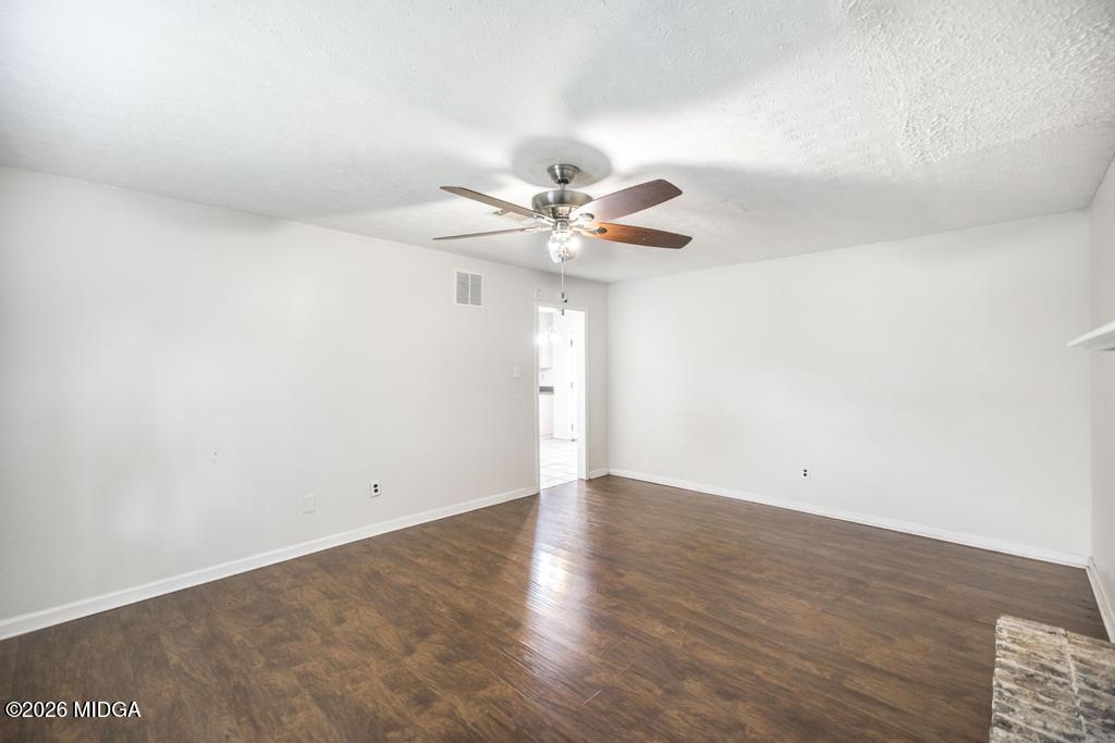 112 Prairie Boulevard Centerville, GA 31028 - Photo 18 of 32 a view of an empty room with chandelier fan