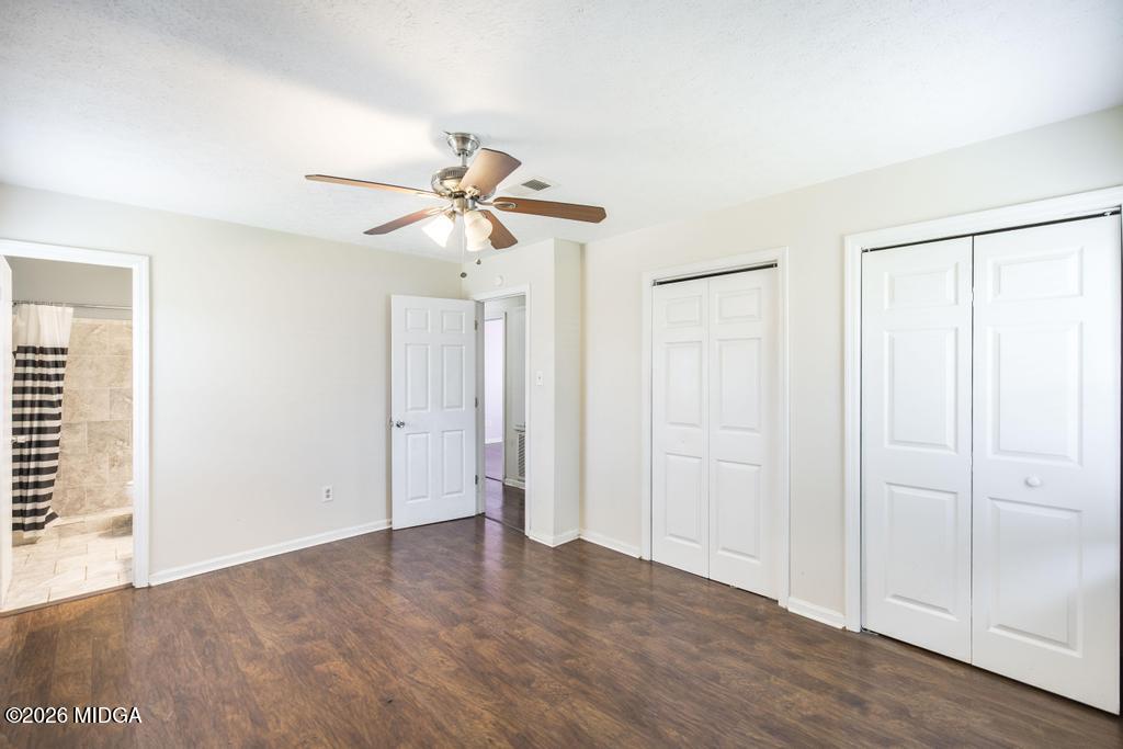 112 Prairie Boulevard Centerville, GA 31028 - Photo 20 of 32 an empty room with closet and a ceiling fan