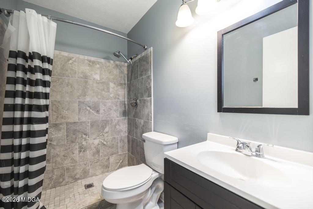 112 Prairie Boulevard Centerville, GA 31028 - Photo 22 of 32 a bathroom with a sink toilet and shower