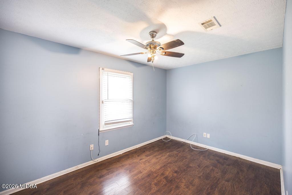 112 Prairie Boulevard Centerville, GA 31028 - Photo 23 of 32 an empty room with a window and a fan