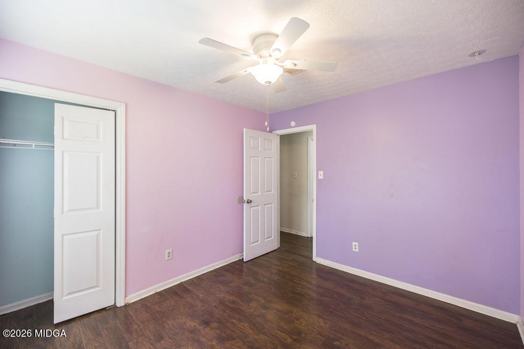 112 Prairie Boulevard Centerville, GA 31028 - Photo 27 of 32 a view of an empty room with wooden floor