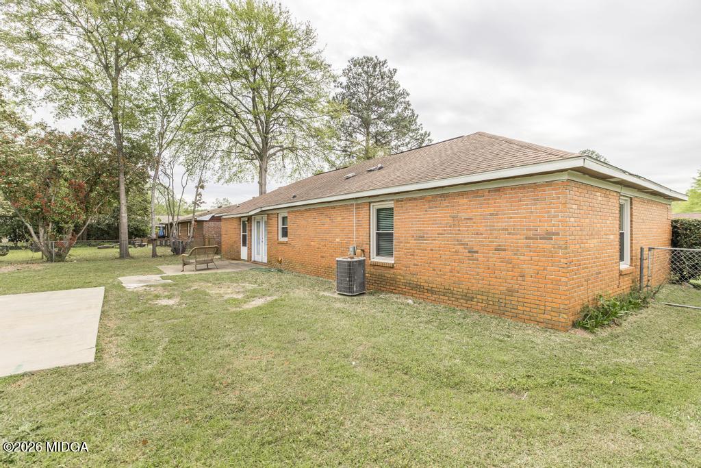 112 Prairie Boulevard Centerville, GA 31028 - Photo 28 of 32 a view of a house with backyard and trees