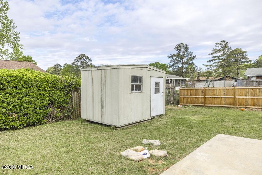 112 Prairie Boulevard Centerville, GA 31028 - Photo 31 of 32 a backyard of a house with lots of green space and garden