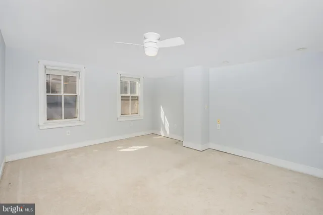 an empty room with windows