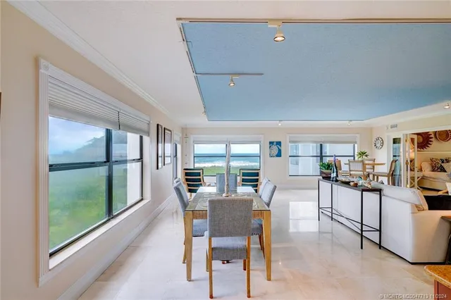 a kitchen with granite countertop a refrigerator stove top oven and sink