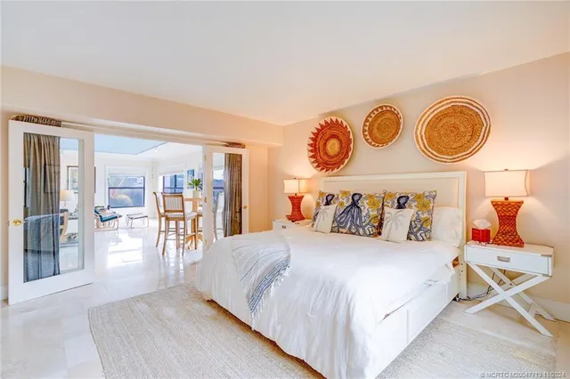 a bedroom with furniture and flat screen tv