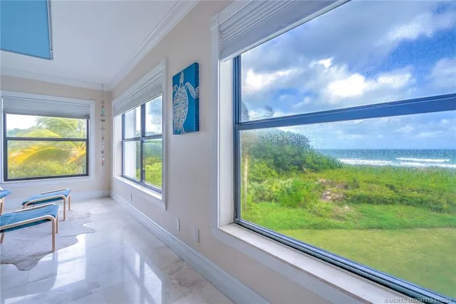 a view of a room with furniture and windows