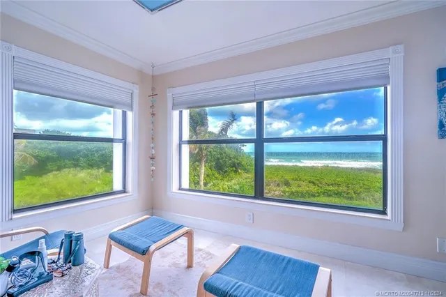 a bedroom with two beds and a flat screen tv