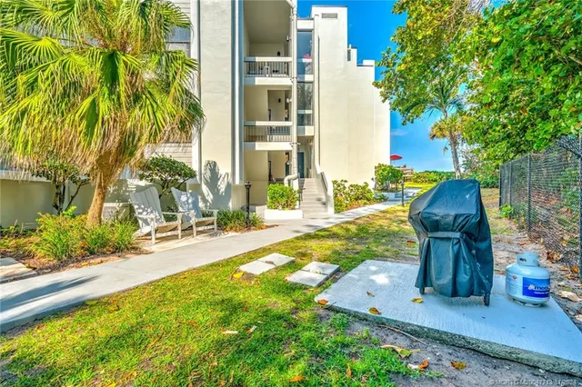 a view of a balcony with wooden floor and city view
