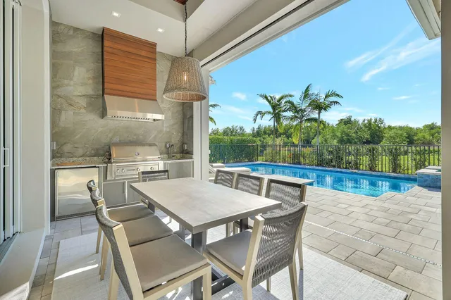 a view of an outdoor dining space with furniture