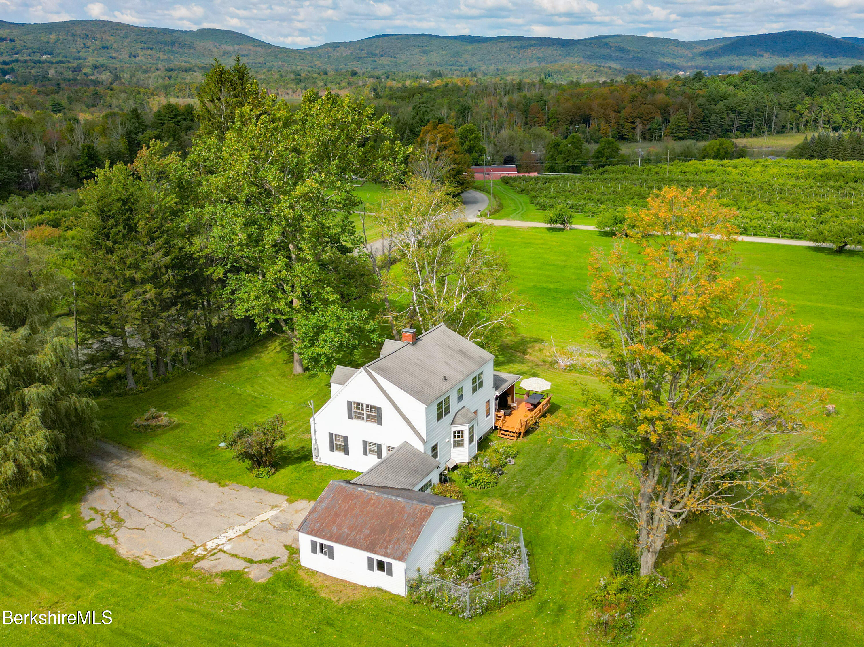 105 Yokun Road Richmond, MA 01201 - Photo 1 of 37 an aerial view of a house with a yard lake view and mountain view