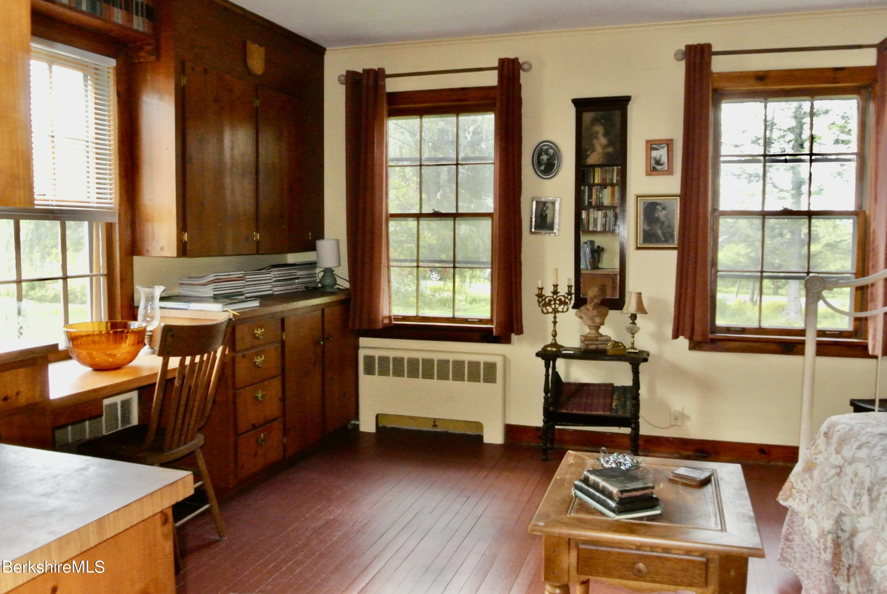105 Yokun Road Richmond, MA 01201 - Photo 14 of 37 a living room with furniture and large windows