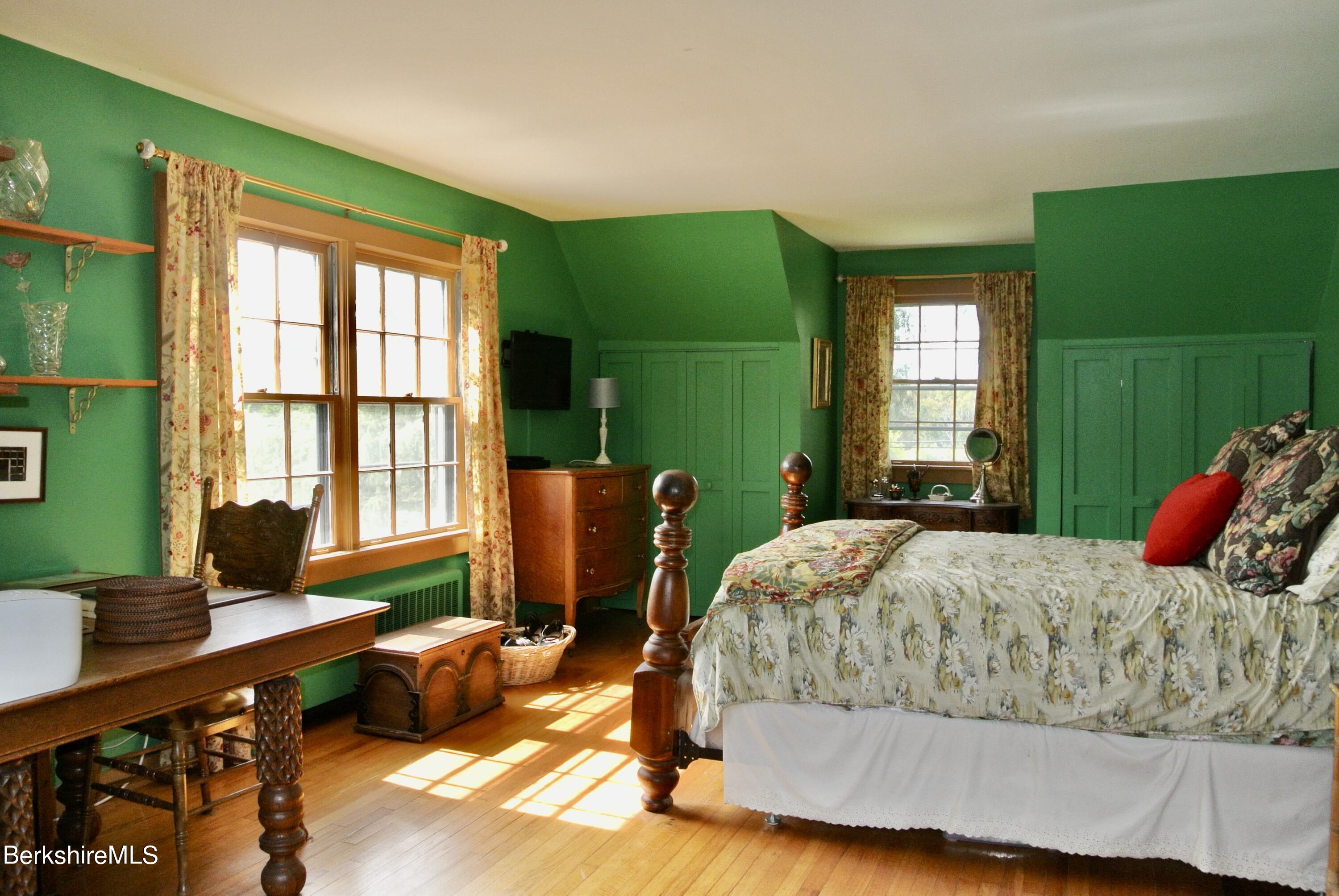 105 Yokun Road Richmond, MA 01201 - Photo 18 of 37 a bedroom with a large bed and a window