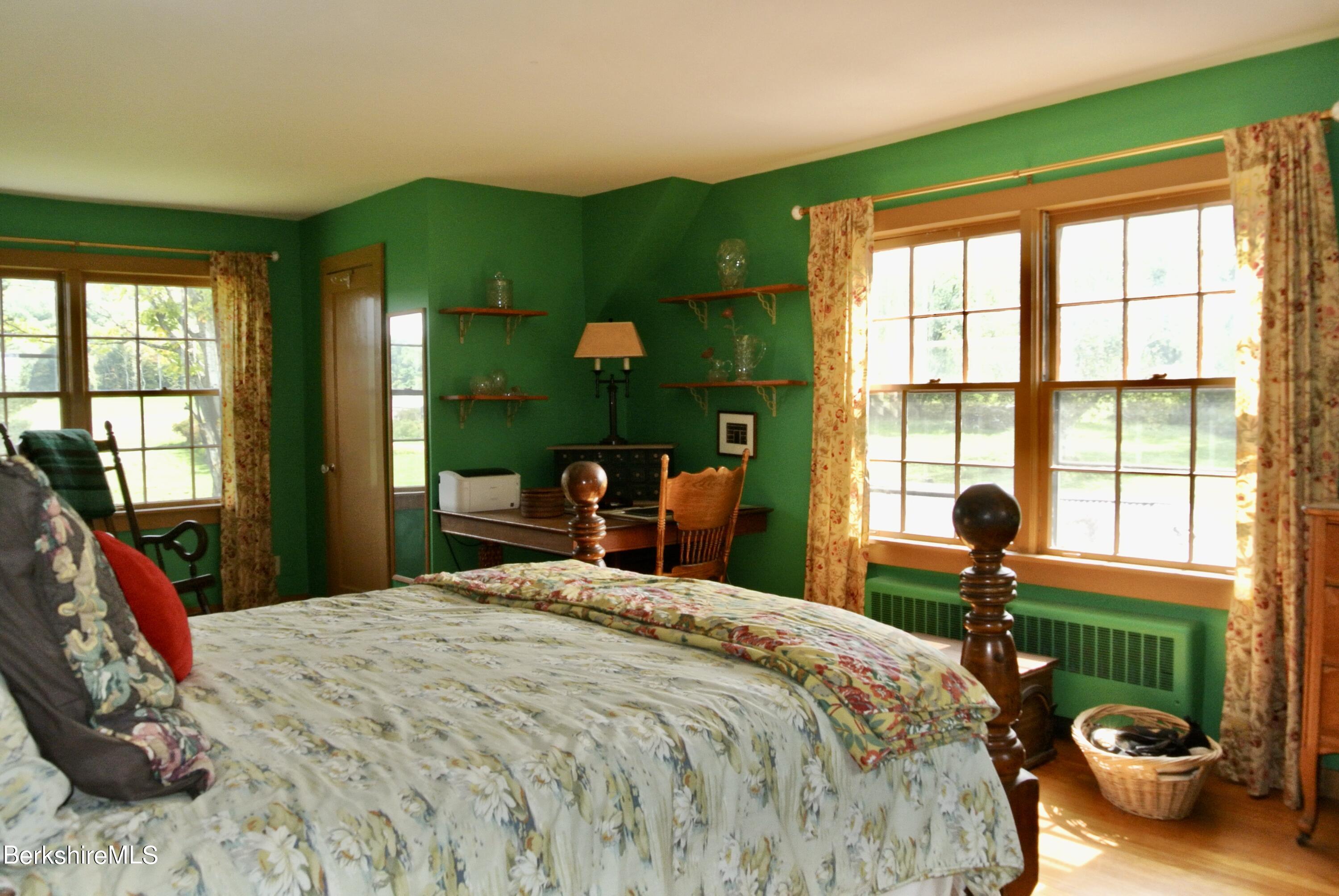 105 Yokun Road Richmond, MA 01201 - Photo 19 of 37 a bedroom with a bed and a large window