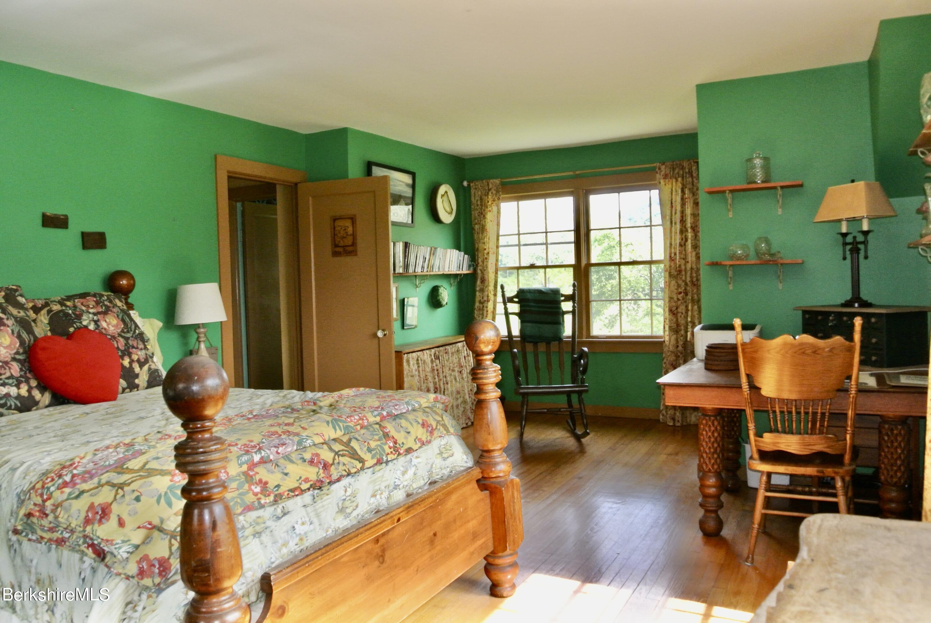105 Yokun Road Richmond, MA 01201 - Photo 20 of 37 a bedroom with a bed table and chairs